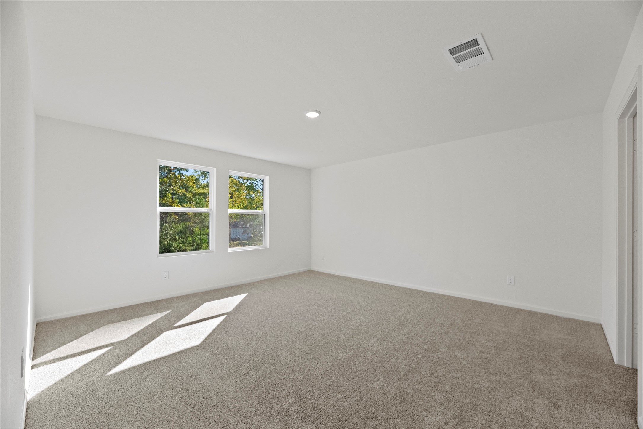 18829 Lucas Michael Way New Caney, TX 77357 - Photo 29 of 40 an empty room with windows