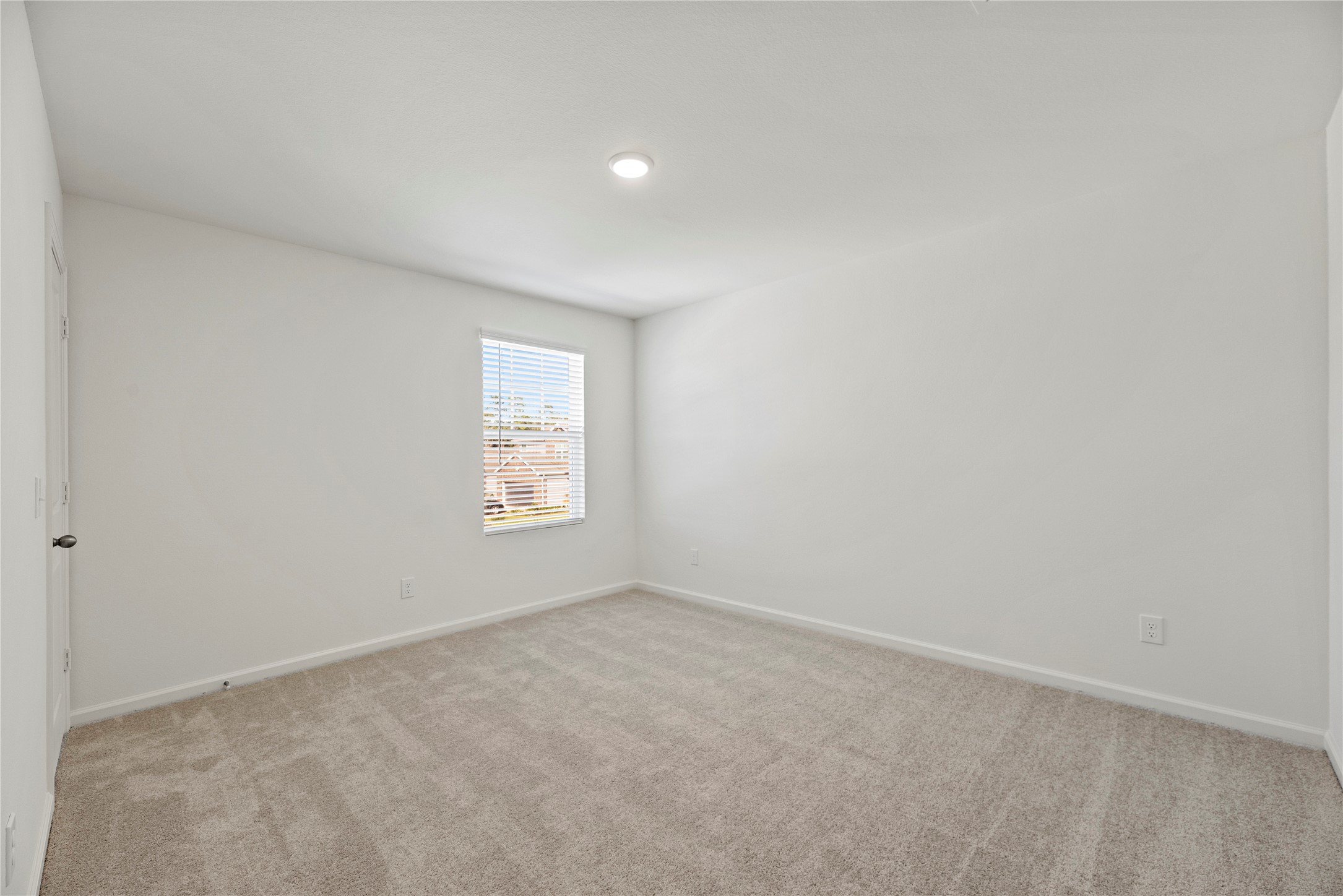 18829 Lucas Michael Way New Caney, TX 77357 - Photo 34 of 40 an empty room with a window