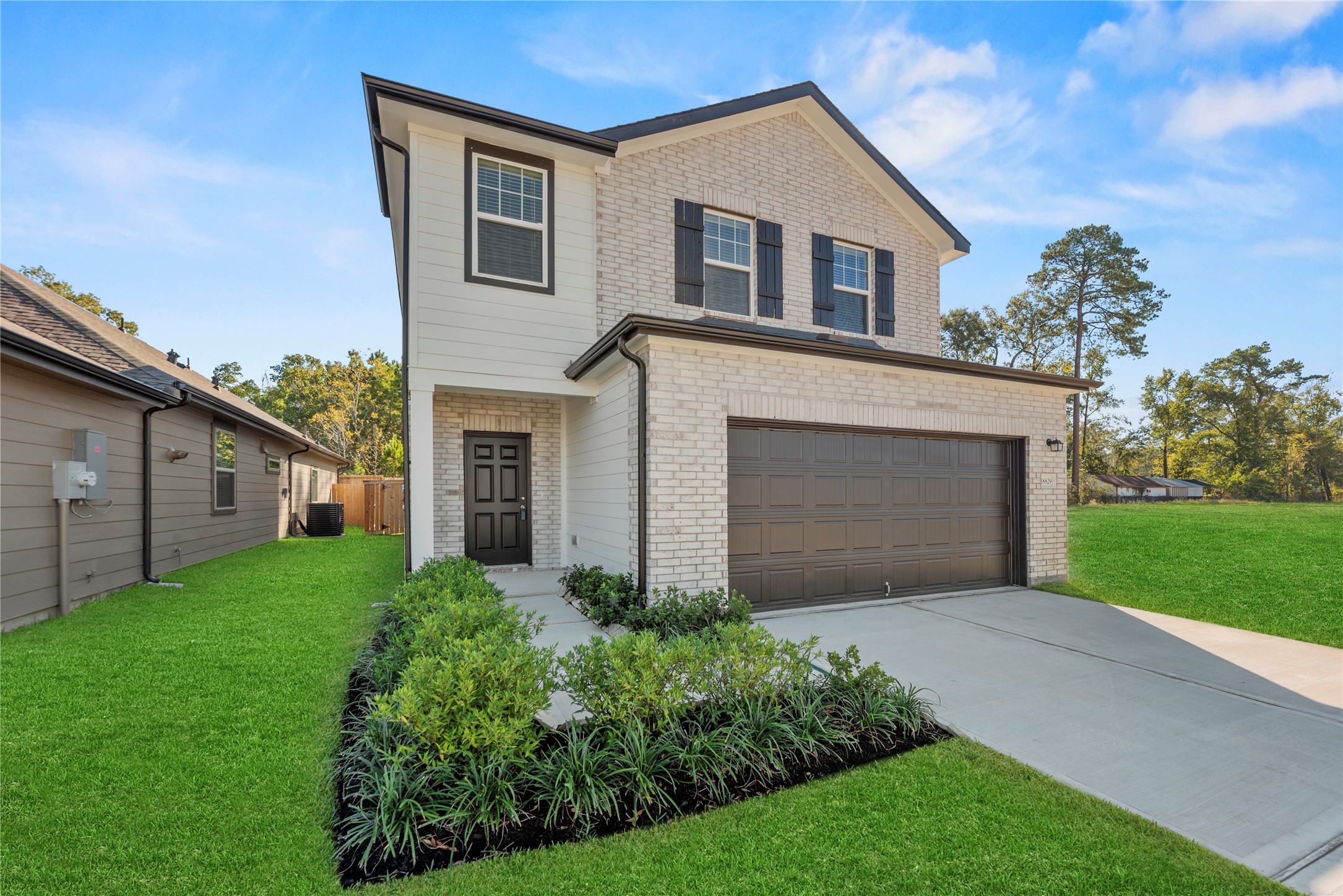 18829 Lucas Michael Way New Caney, TX 77357 - Photo 4 of 40 a front view of house with yard and green space
