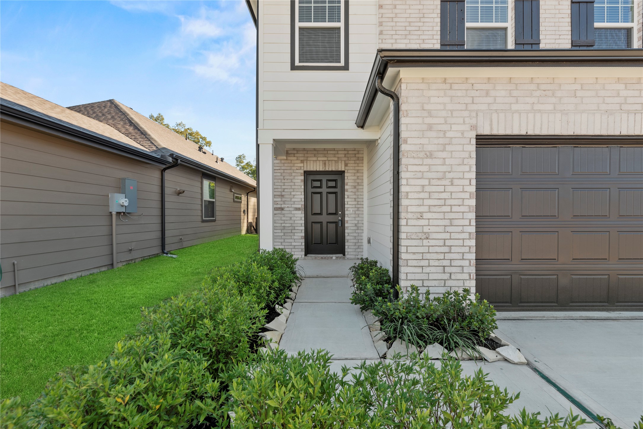 18829 Lucas Michael Way New Caney, TX 77357 - Photo 6 of 40 a front view of a house with garden