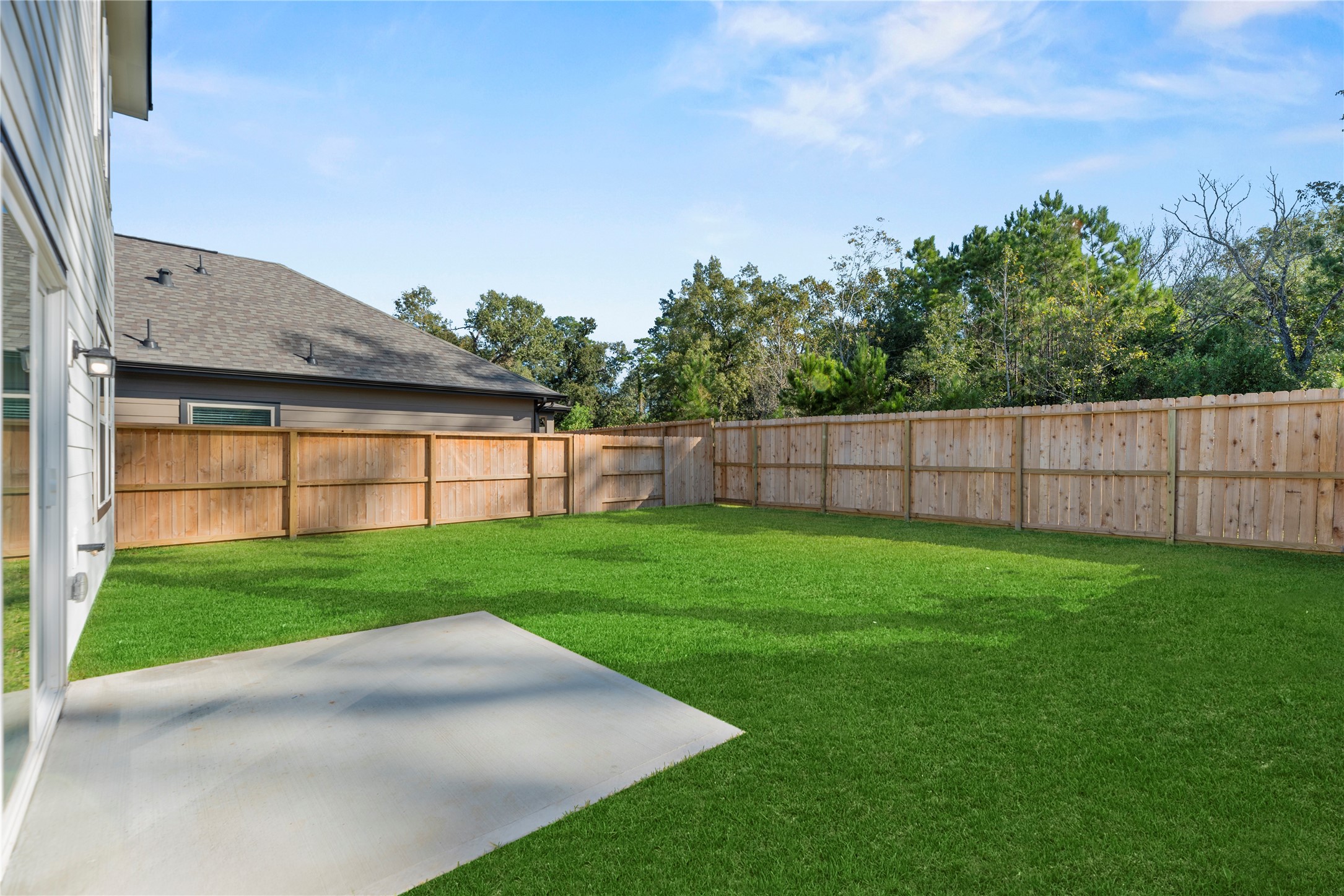 18829 Lucas Michael Way New Caney, TX 77357 - Photo 7 of 40 a view of a backyard with a garden