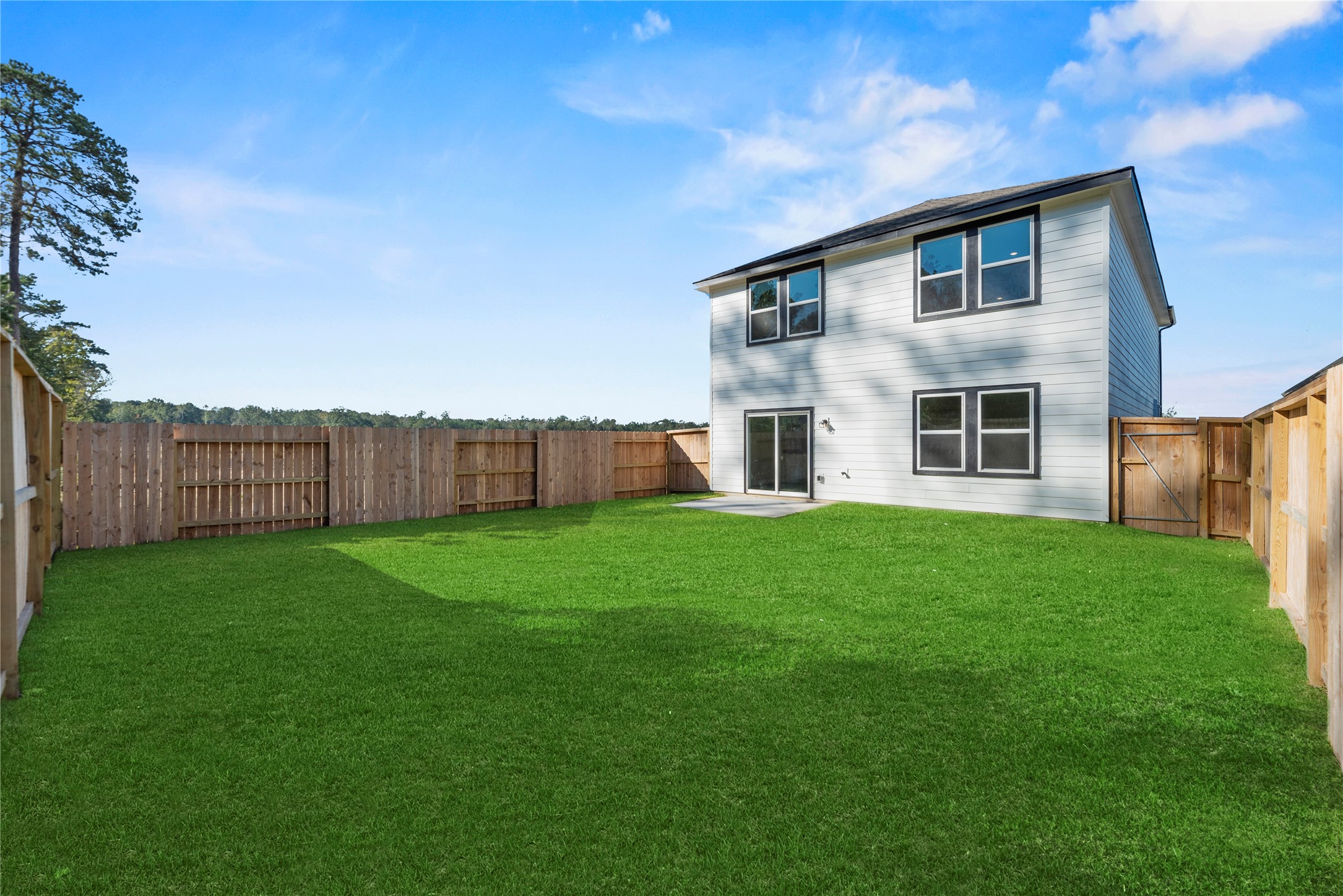 18829 Lucas Michael Way New Caney, TX 77357 - Photo 8 of 40 a view of a house with backyard