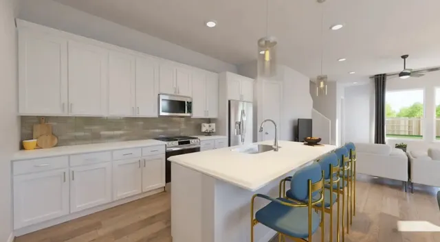 a kitchen that has a table and chairs in it