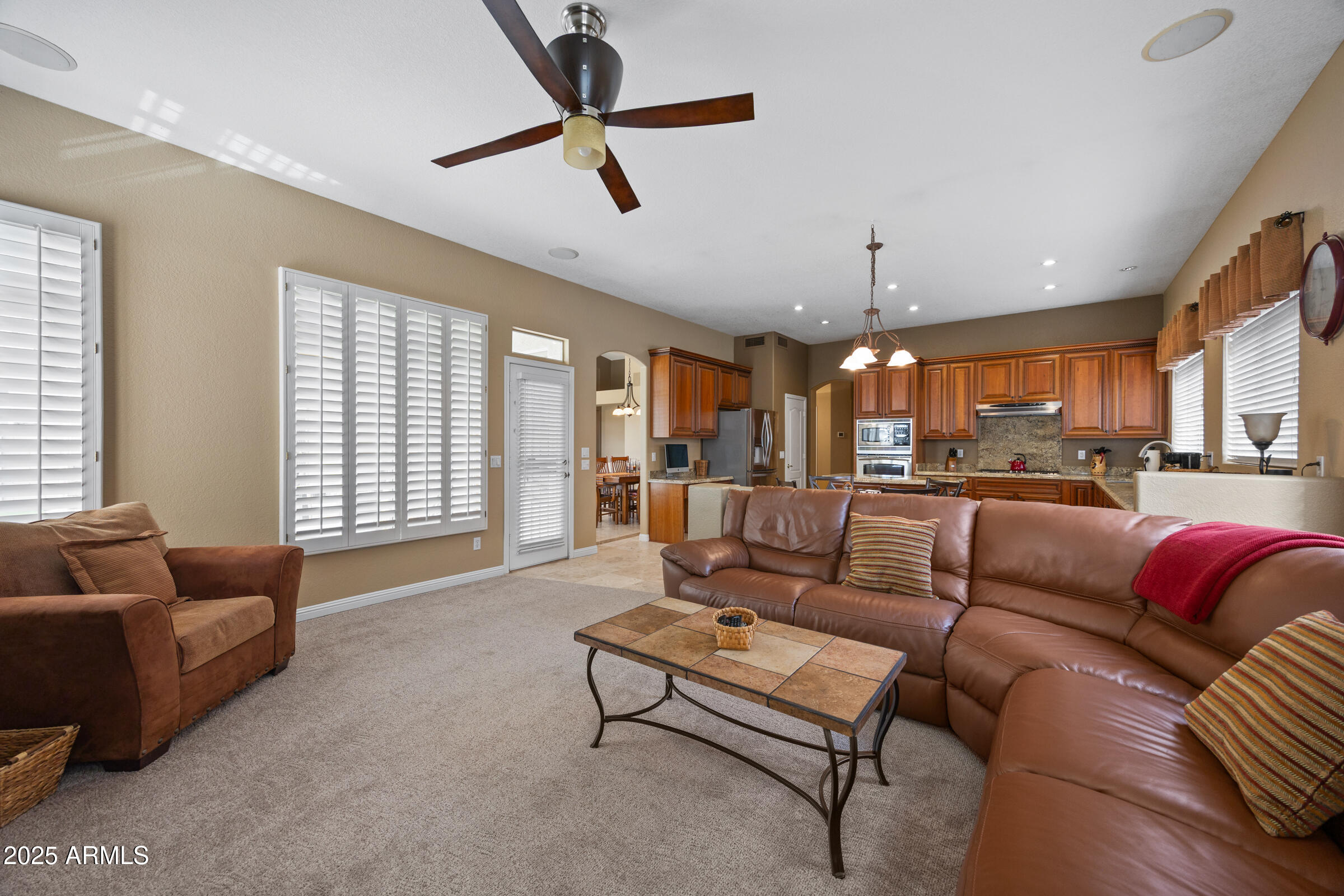 269 West El Freda Road Tempe, AZ 85284 - Photo 13 of 54 a living room with furniture ceiling fan and a window