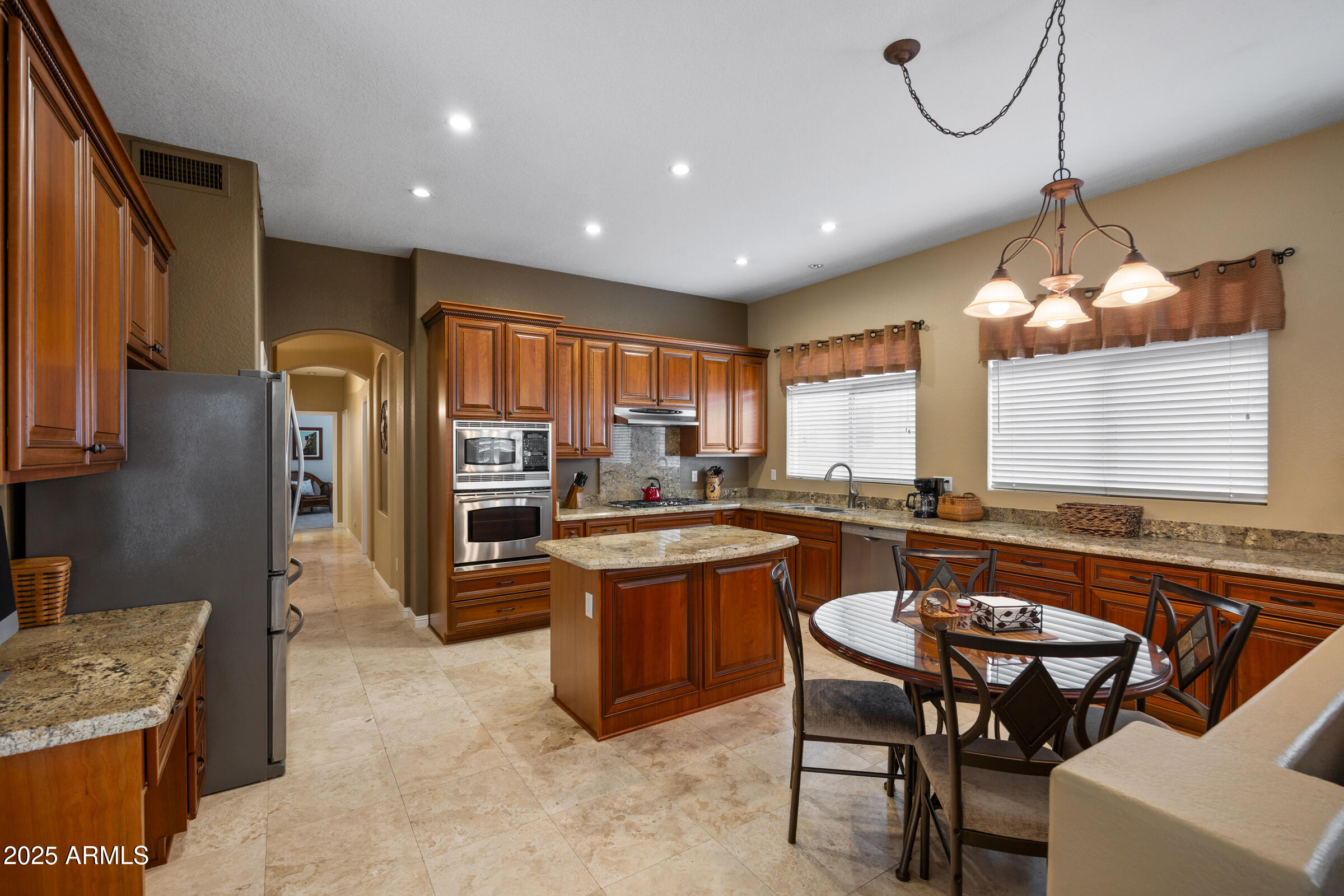 269 West El Freda Road Tempe, AZ 85284 - Photo 14 of 54 a kitchen with stainless steel appliances granite countertop counter space a sink refrigerator and cabinets