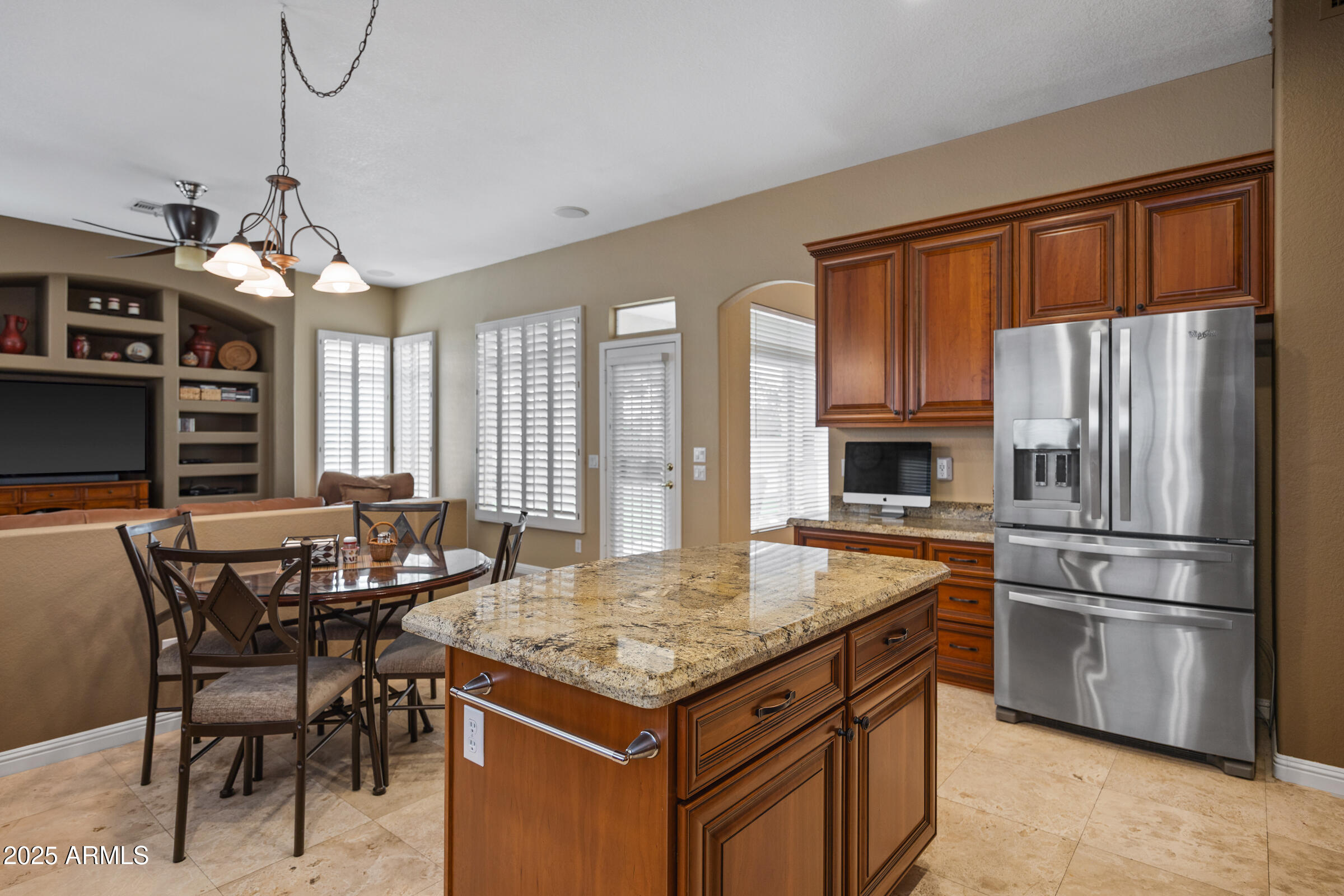 269 West El Freda Road Tempe, AZ 85284 - Photo 20 of 54 a kitchen with a stove a refrigerator and a dining table