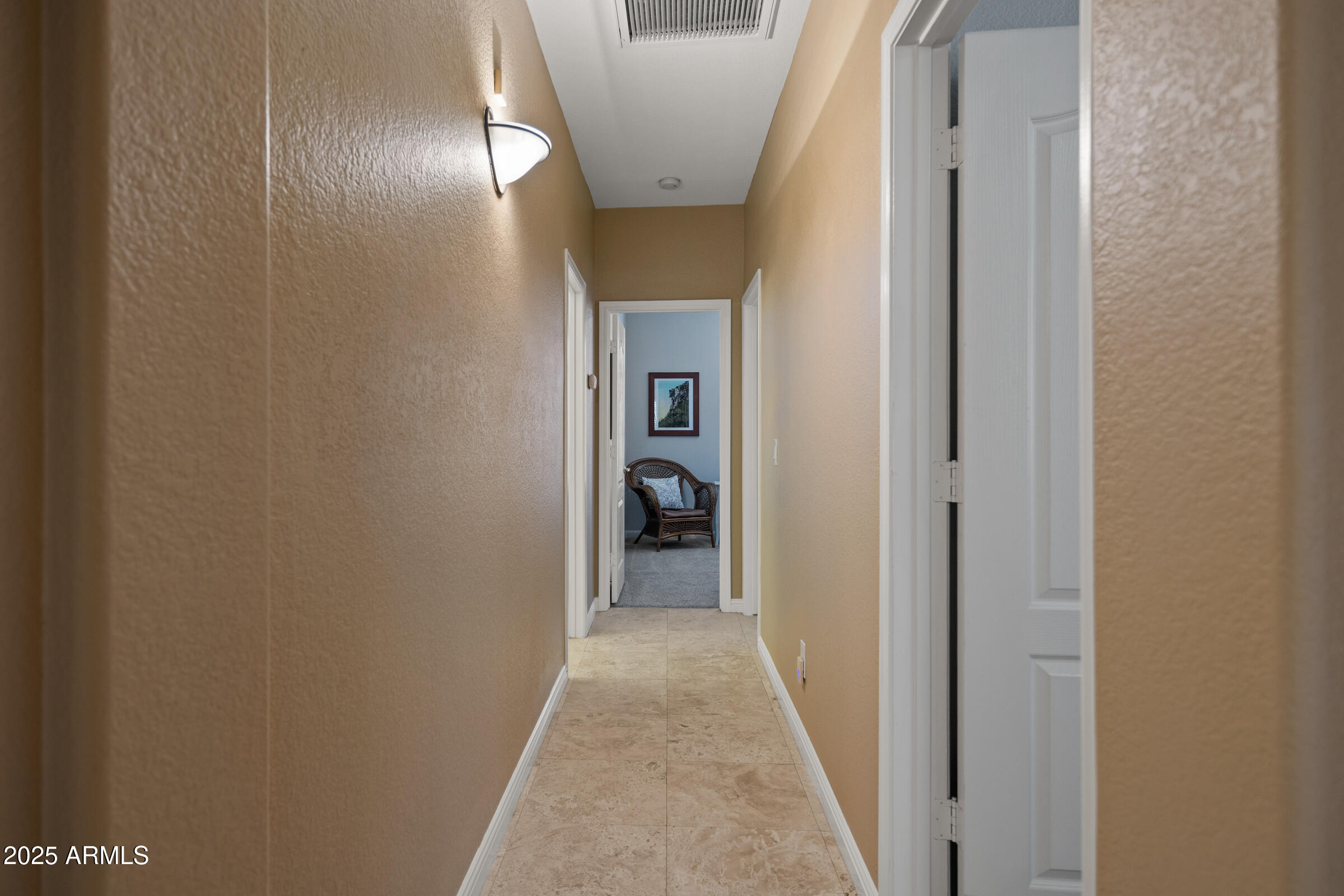 269 West El Freda Road Tempe, AZ 85284 - Photo 21 of 54 a view of a hallway with wooden floor and a bathroom