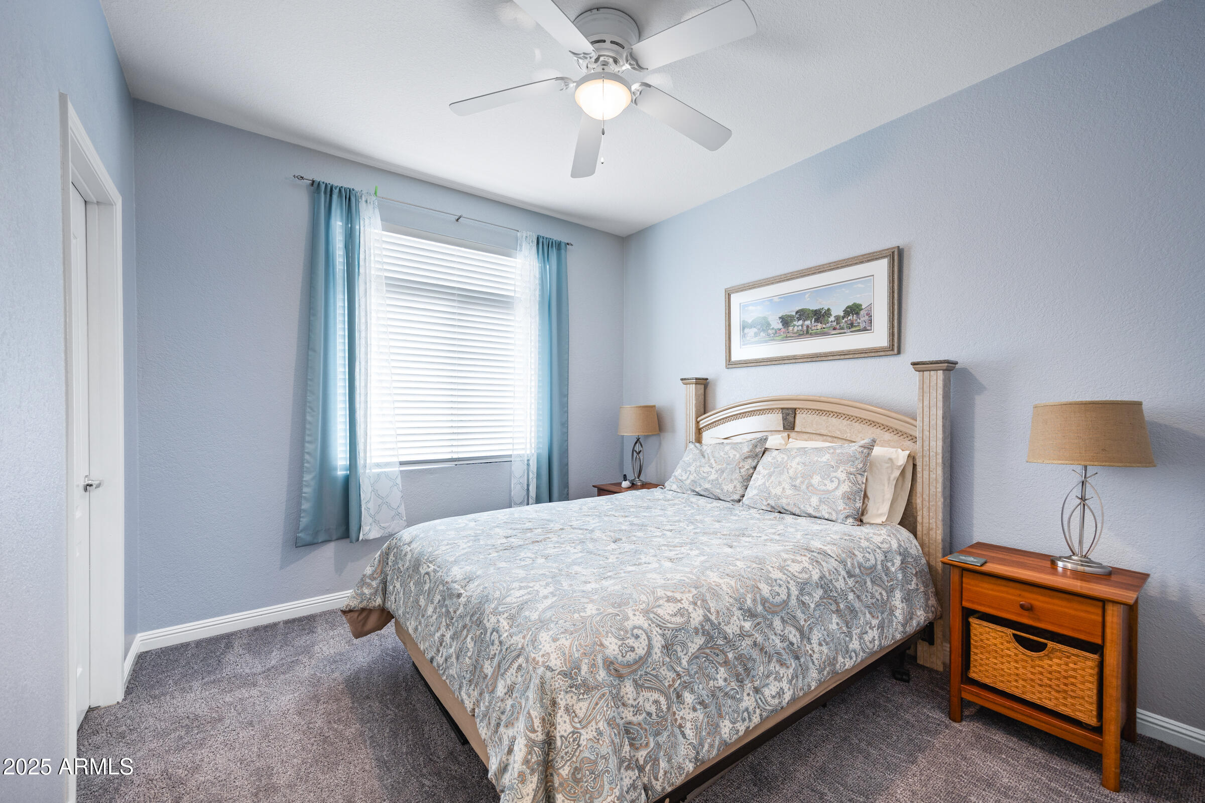 269 West El Freda Road Tempe, AZ 85284 - Photo 23 of 54 a bedroom with a bed and a chandelier