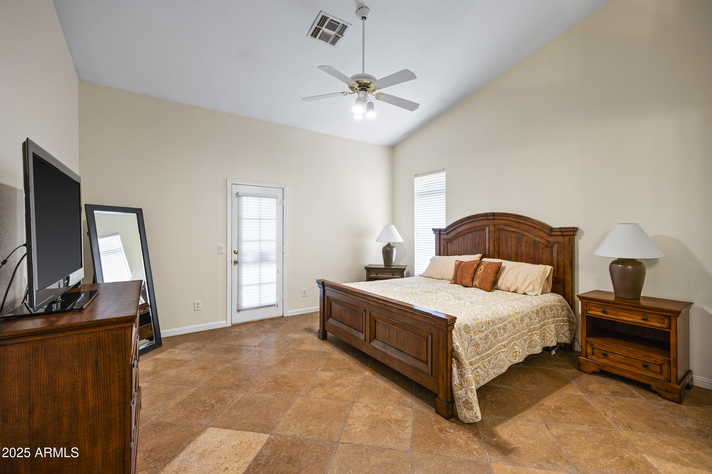 269 West El Freda Road Tempe, AZ 85284 - Photo 27 of 54 a bedroom with a bed and a flat tv screen on dresser