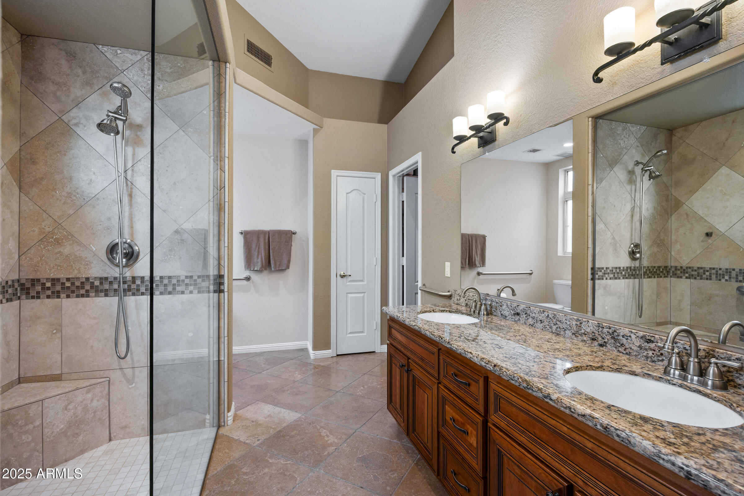 269 West El Freda Road Tempe, AZ 85284 - Photo 29 of 54 a bathroom with a granite countertop sink a mirror a shower and a bathtub