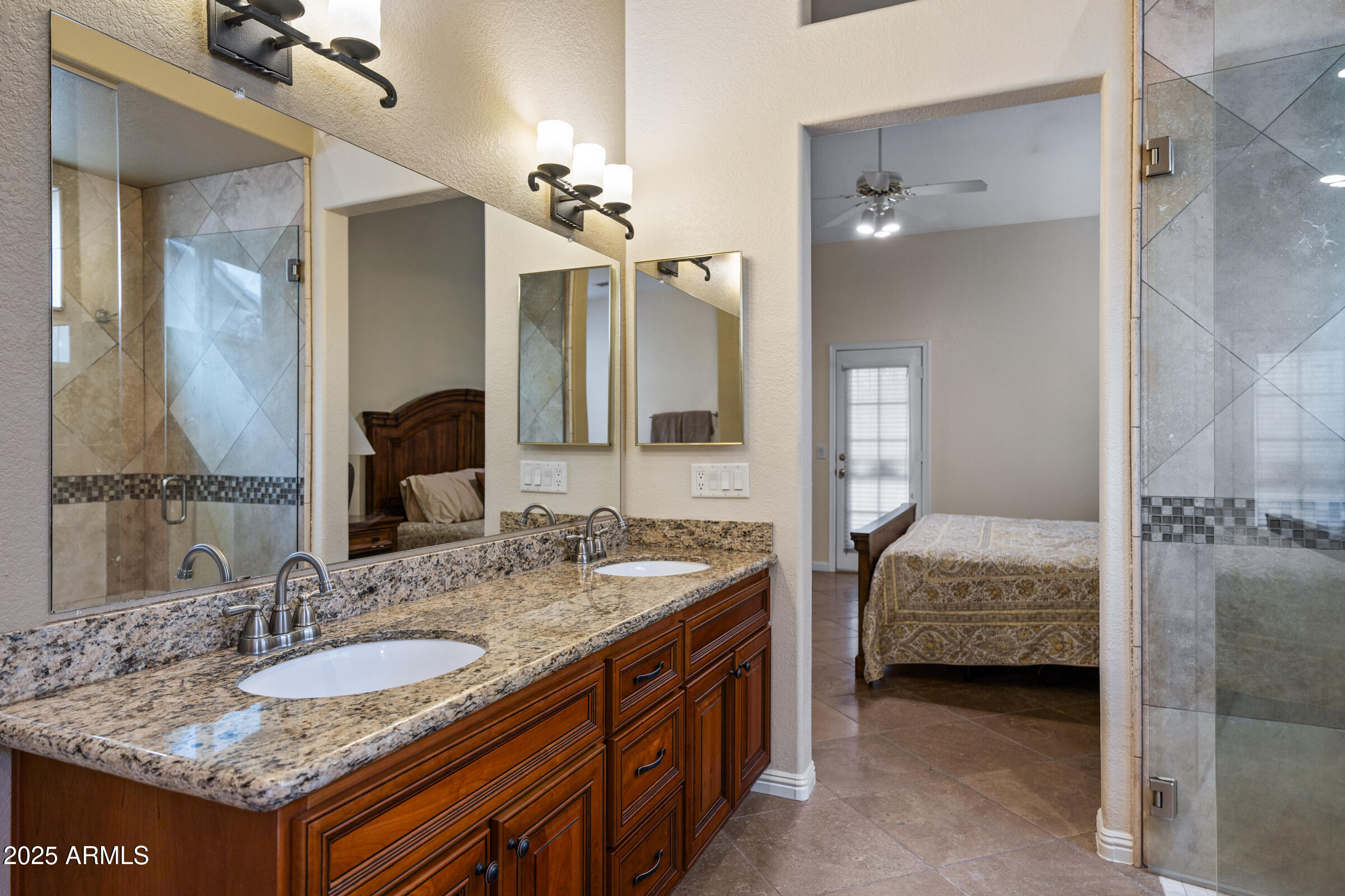 269 West El Freda Road Tempe, AZ 85284 - Photo 30 of 54 a en suite bathroom with a granite countertop double vanity sink and a mirror