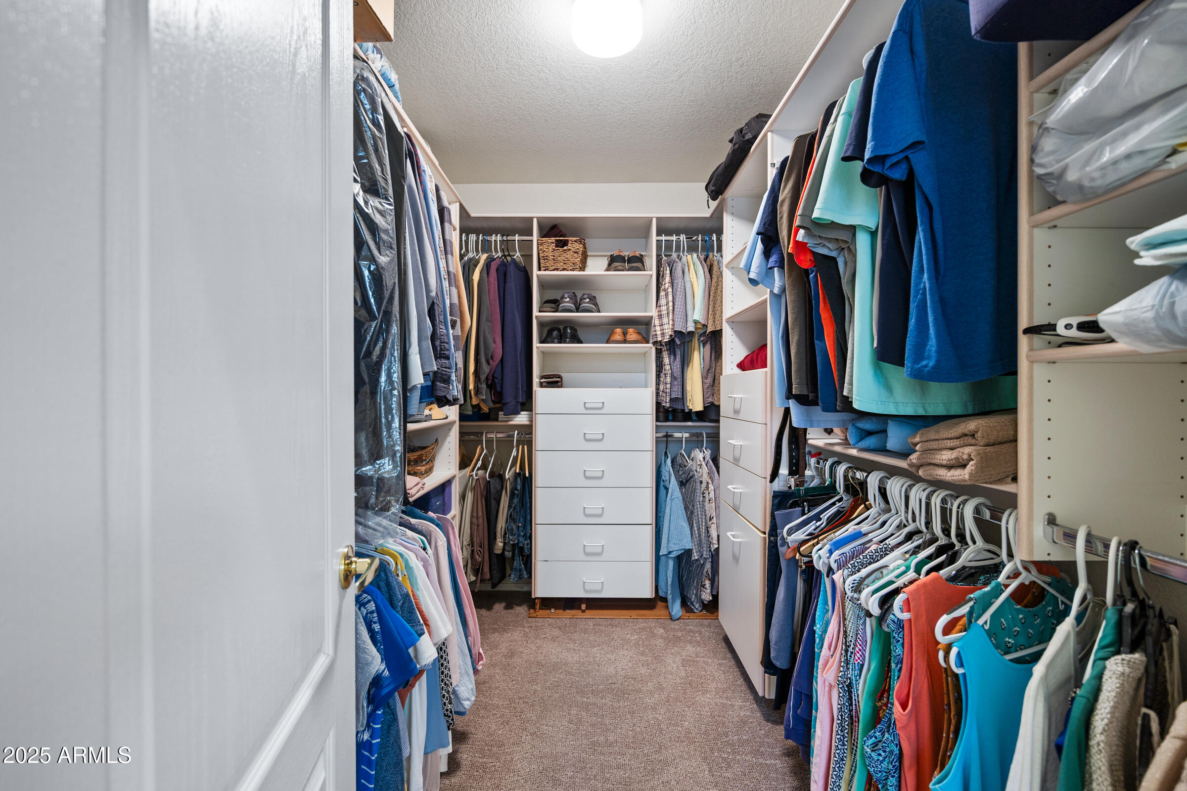 269 West El Freda Road Tempe, AZ 85284 - Photo 32 of 54 a view of walk in closet with clothes