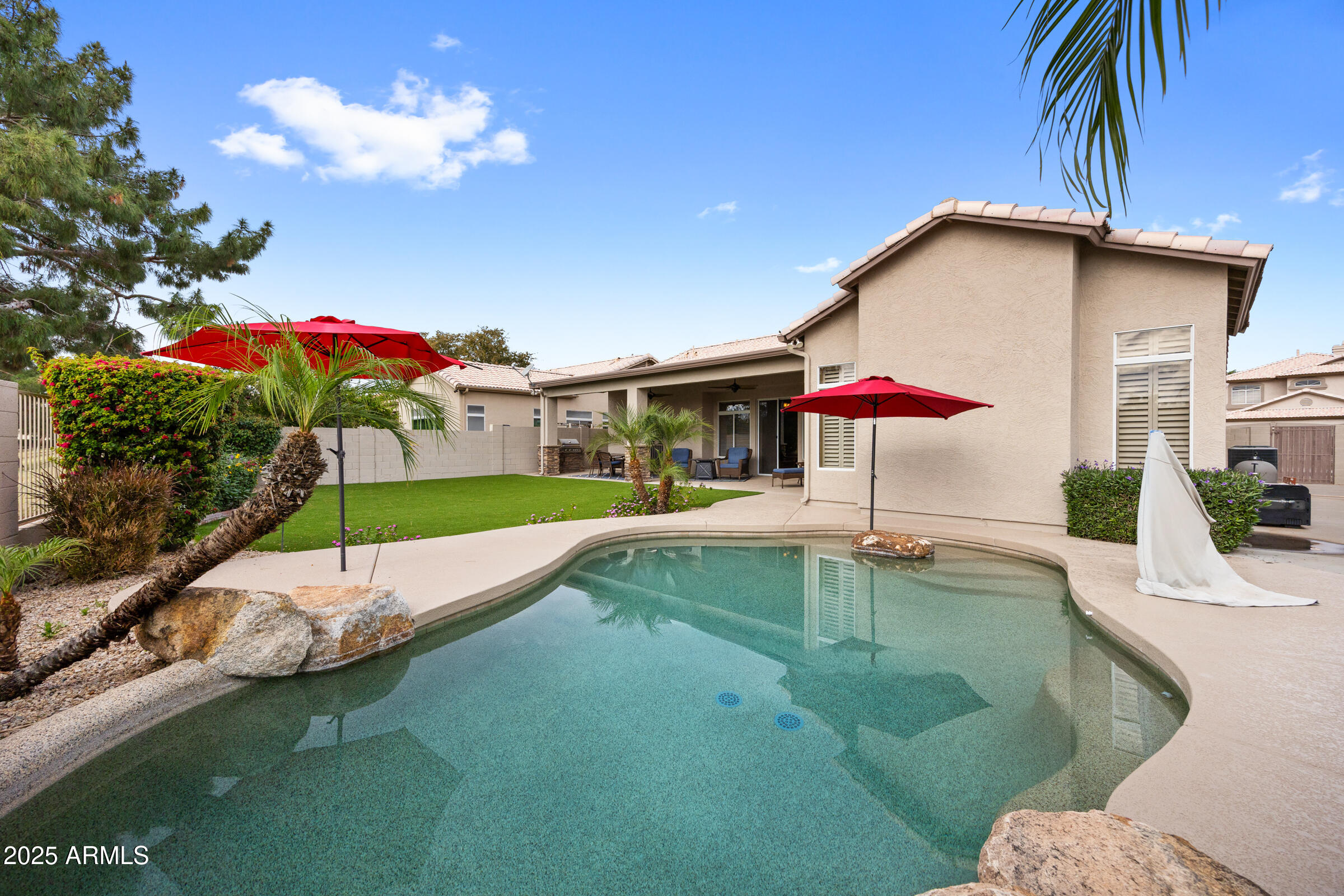269 West El Freda Road Tempe, AZ 85284 - Photo 36 of 54 a house view with a swimming pool