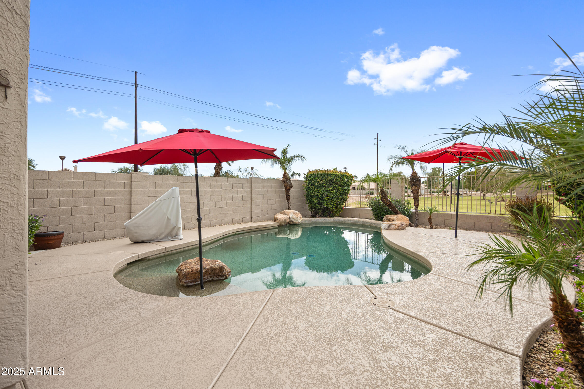 269 West El Freda Road Tempe, AZ 85284 - Photo 37 of 54 a swimming pool with outdoor seating