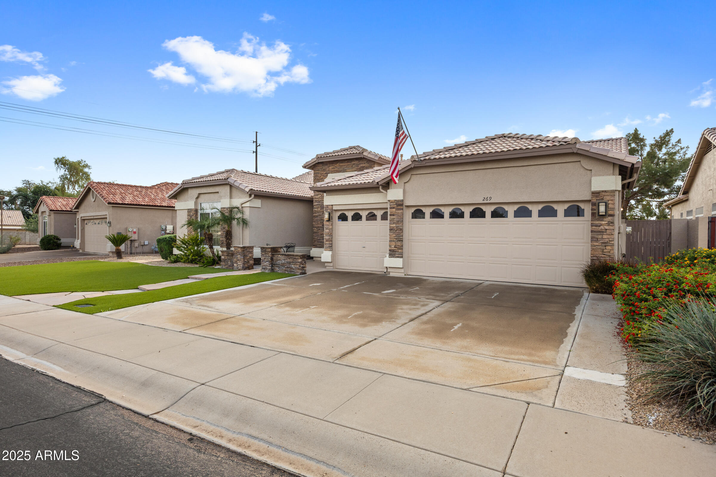 269 West El Freda Road Tempe, AZ 85284 - Photo 4 of 54 a front view of a house with a yard and garage