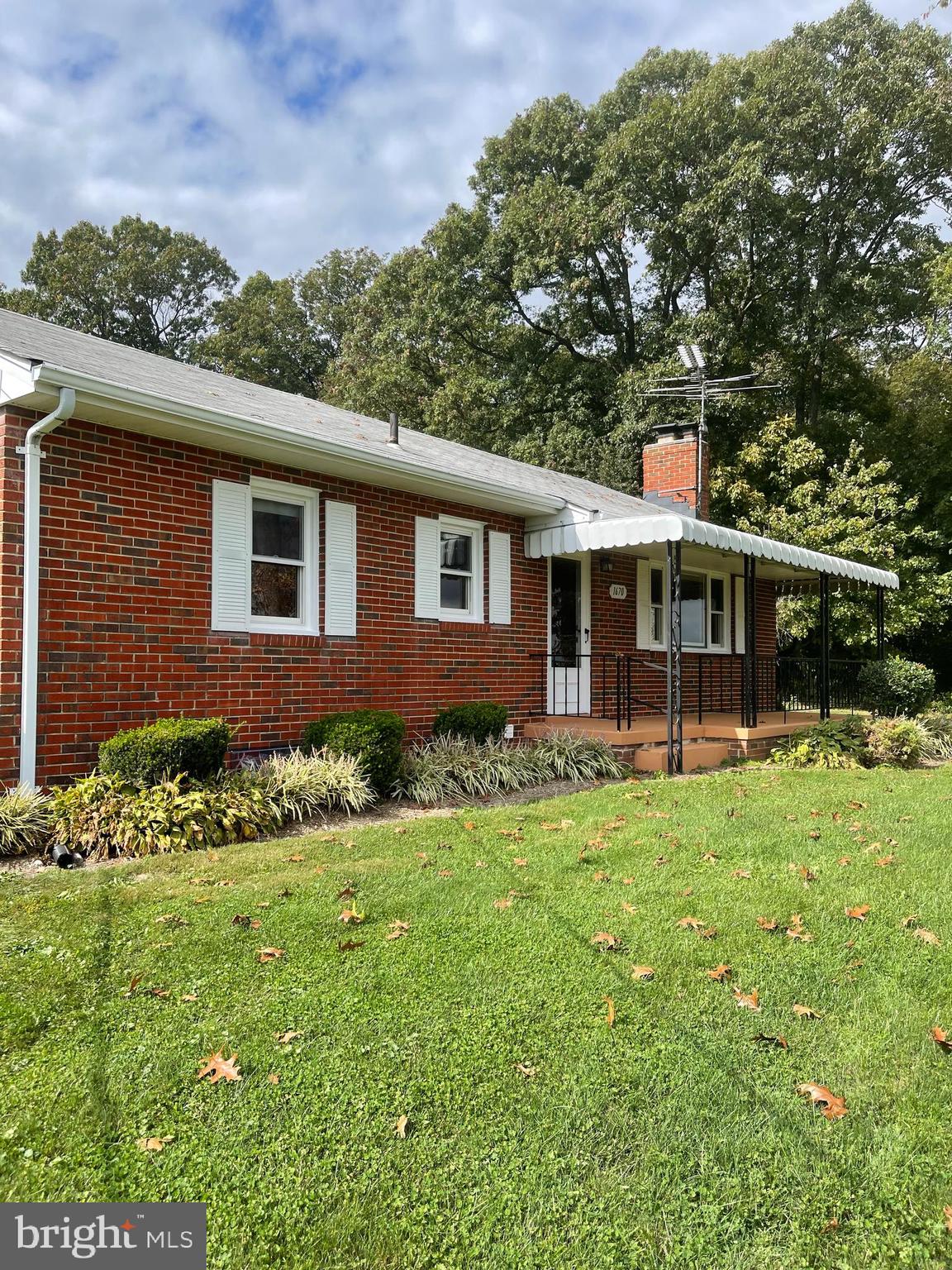 1670 Florence Road Mount Airy, MD 21771 - Photo 2 of 20 a front view of a house with a garden