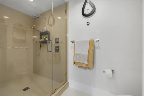 a living room with furniture fireplace and a large window