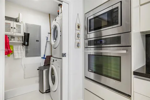 a room with lots of chairs and a potted plant