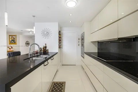 a kitchen with counter top space and stainless steel appliances