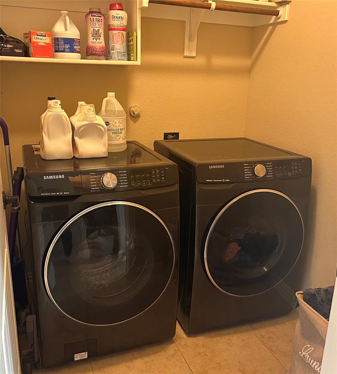16117 Harper Road Prosper, TX 75078 - Photo 5 of 8 a utility room with dryer and washer