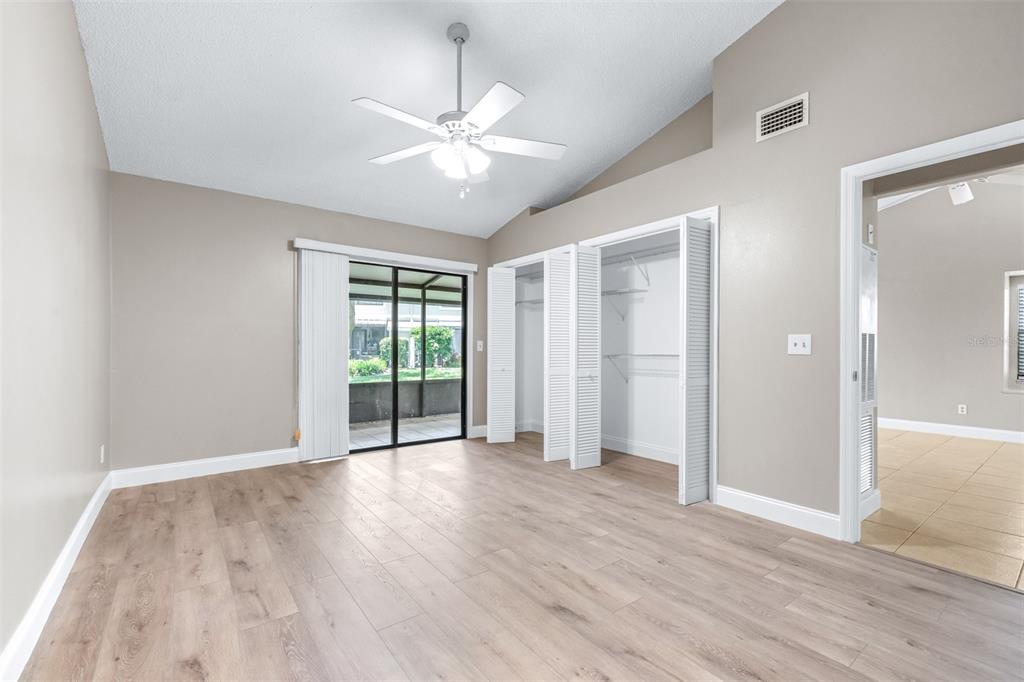 5100 Burchette Road, Unit 2505 Tampa, FL 33647 - Photo 18 of 47 a view of an empty room with wooden floor and a window