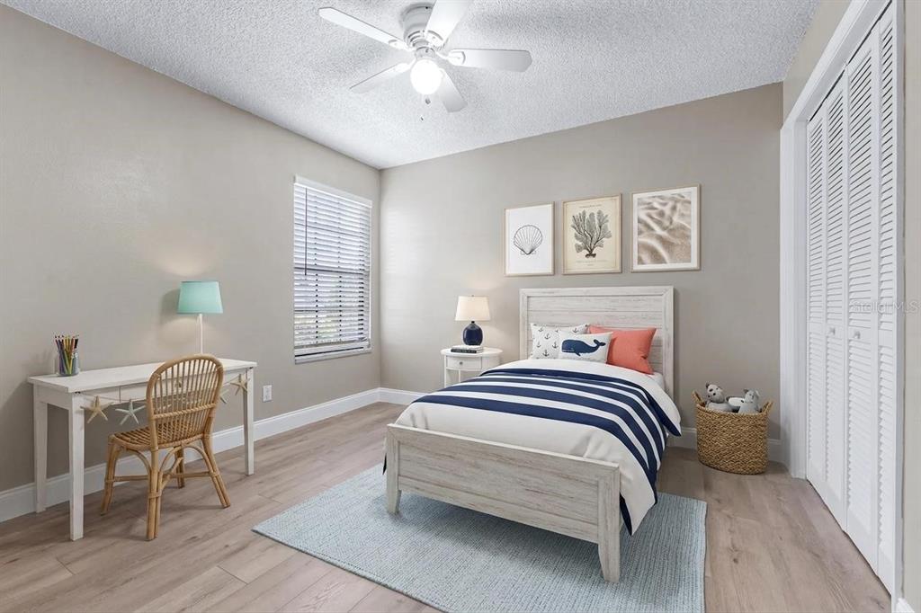 5100 Burchette Road, Unit 2505 Tampa, FL 33647 - Photo 25 of 47 a bedroom with a bed and a chair in it