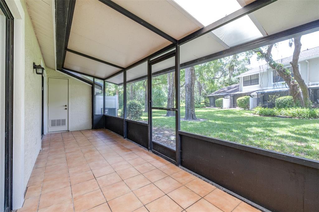 5100 Burchette Road, Unit 2505 Tampa, FL 33647 - Photo 32 of 47 a view of a porch and garden