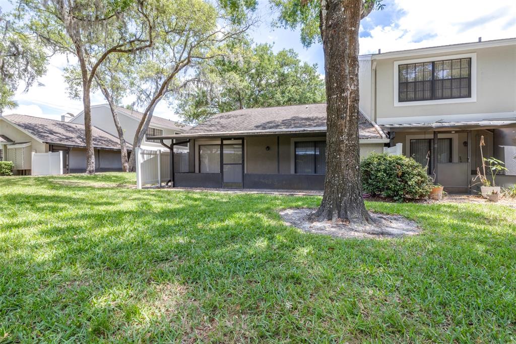 5100 Burchette Road, Unit 2505 Tampa, FL 33647 - Photo 35 of 47 a view of a house with a yard and tree s