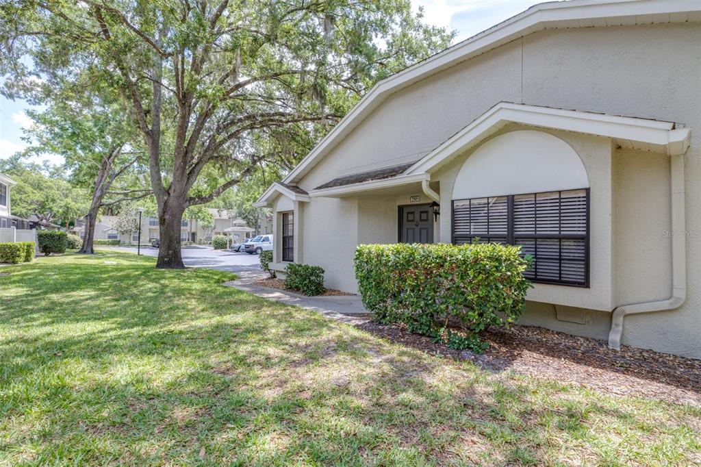 5100 Burchette Road, Unit 2505 Tampa, FL 33647 - Photo 6 of 47 a front view of a house with garden