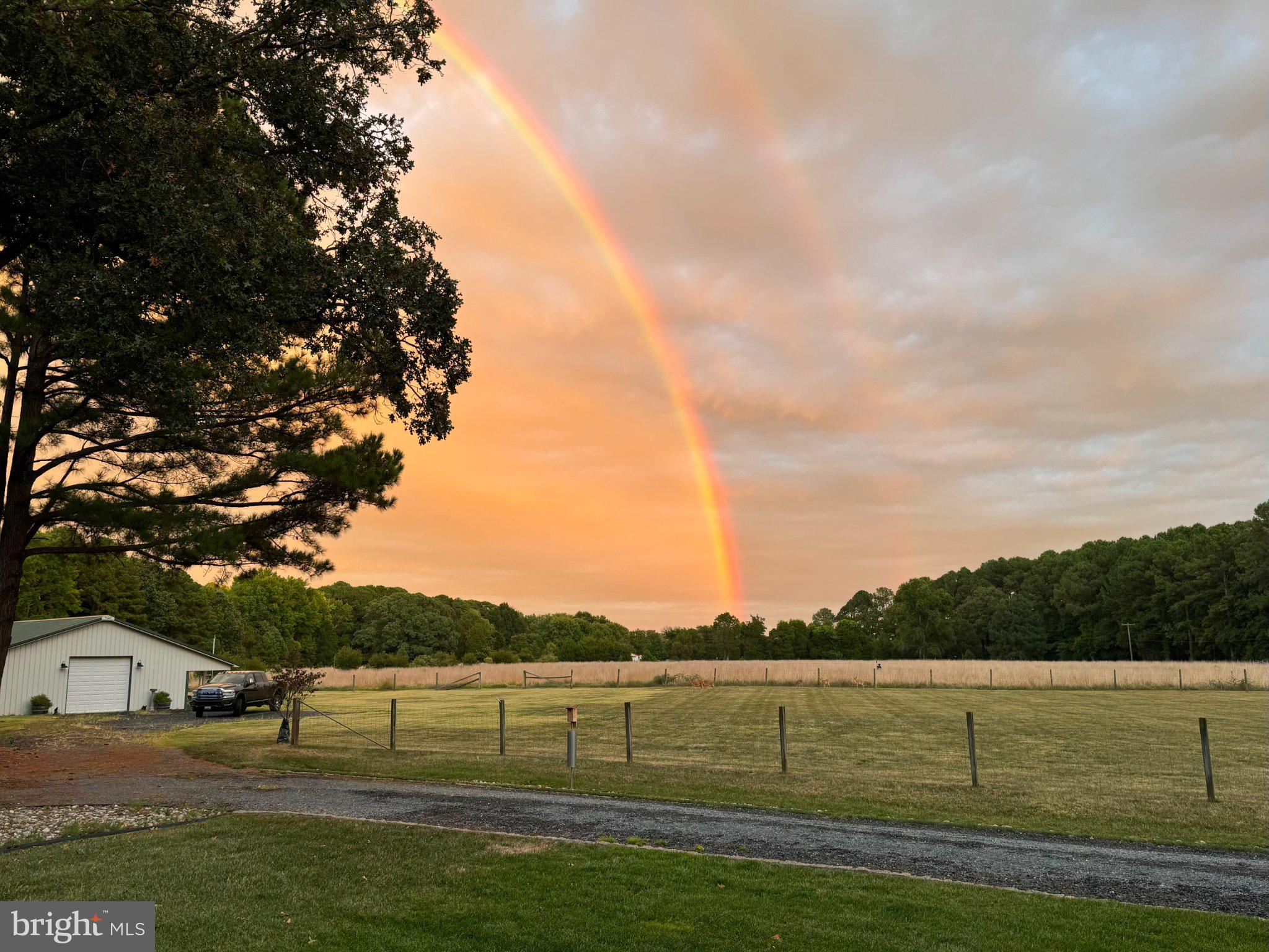 7909 Church Neck Road St. Michaels, MD 21663 - Photo 1 of 50 Sunset hues beneath a vibrant rainbow.
