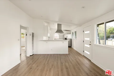 a view of kitchen with wooden floor
