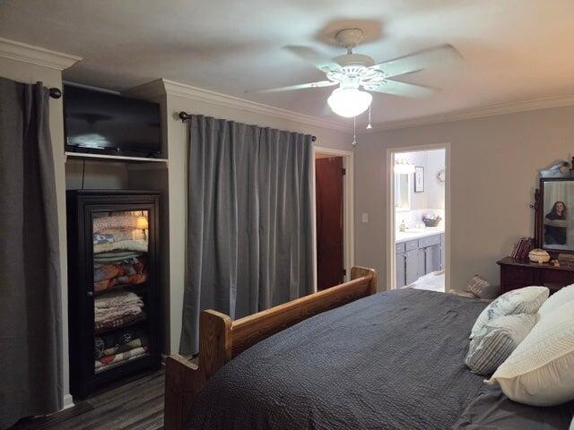 2596 Keith Valley Road Southeast Cleveland, TN 37323 - Photo 22 of 24 a bedroom with a bed and a chandelier