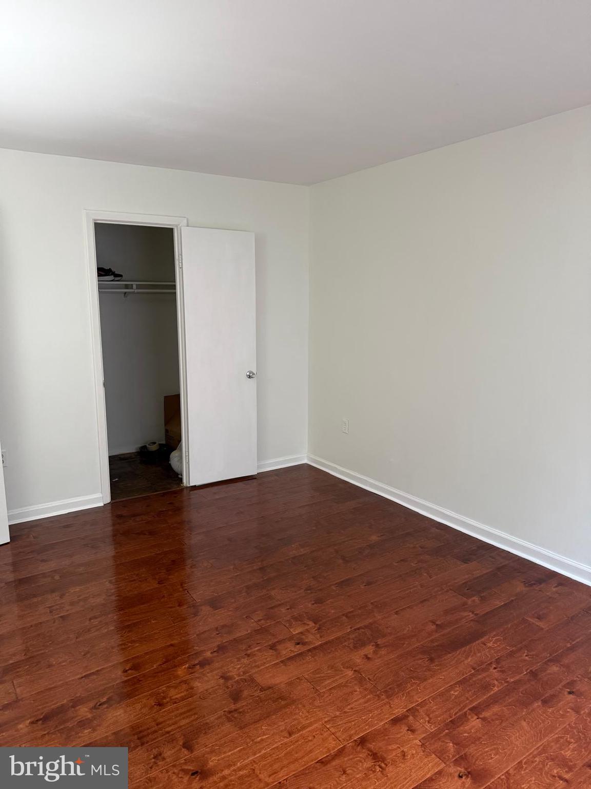 1604 Renate Drive, Unit 104 Woodbridge, VA 22192 - Photo 20 of 29 a view of an empty room with wooden floor