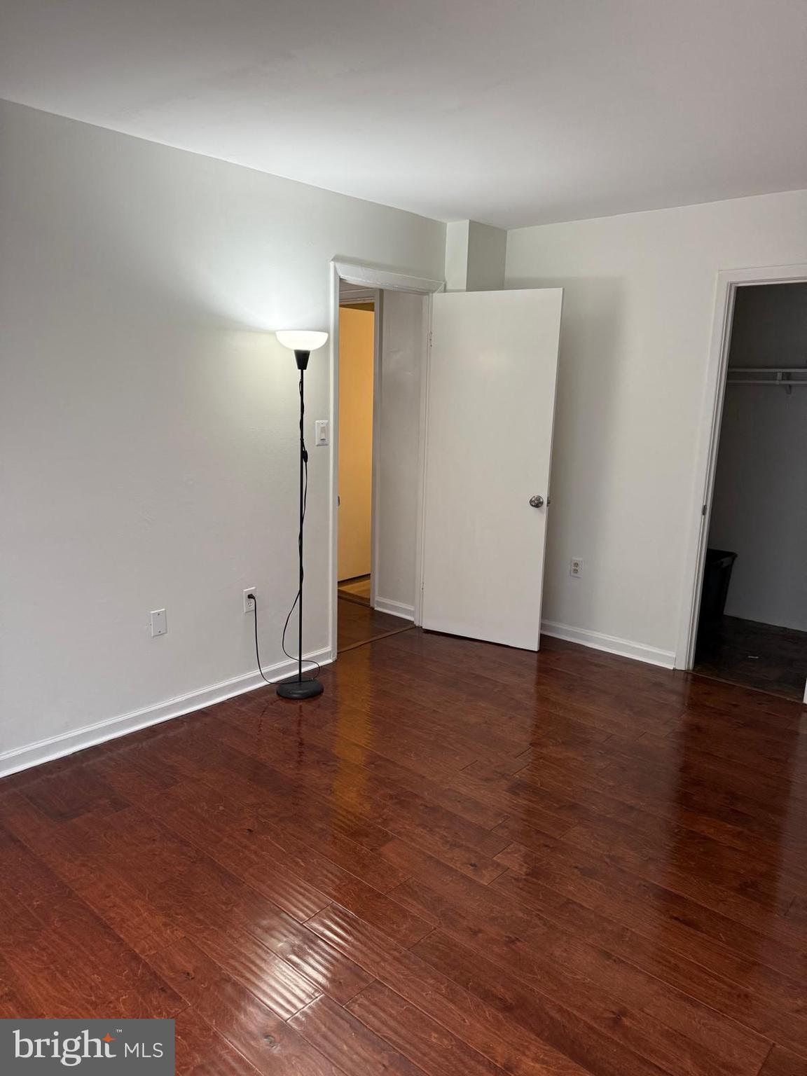 1604 Renate Drive, Unit 104 Woodbridge, VA 22192 - Photo 21 of 29 an empty room with wooden floor and window