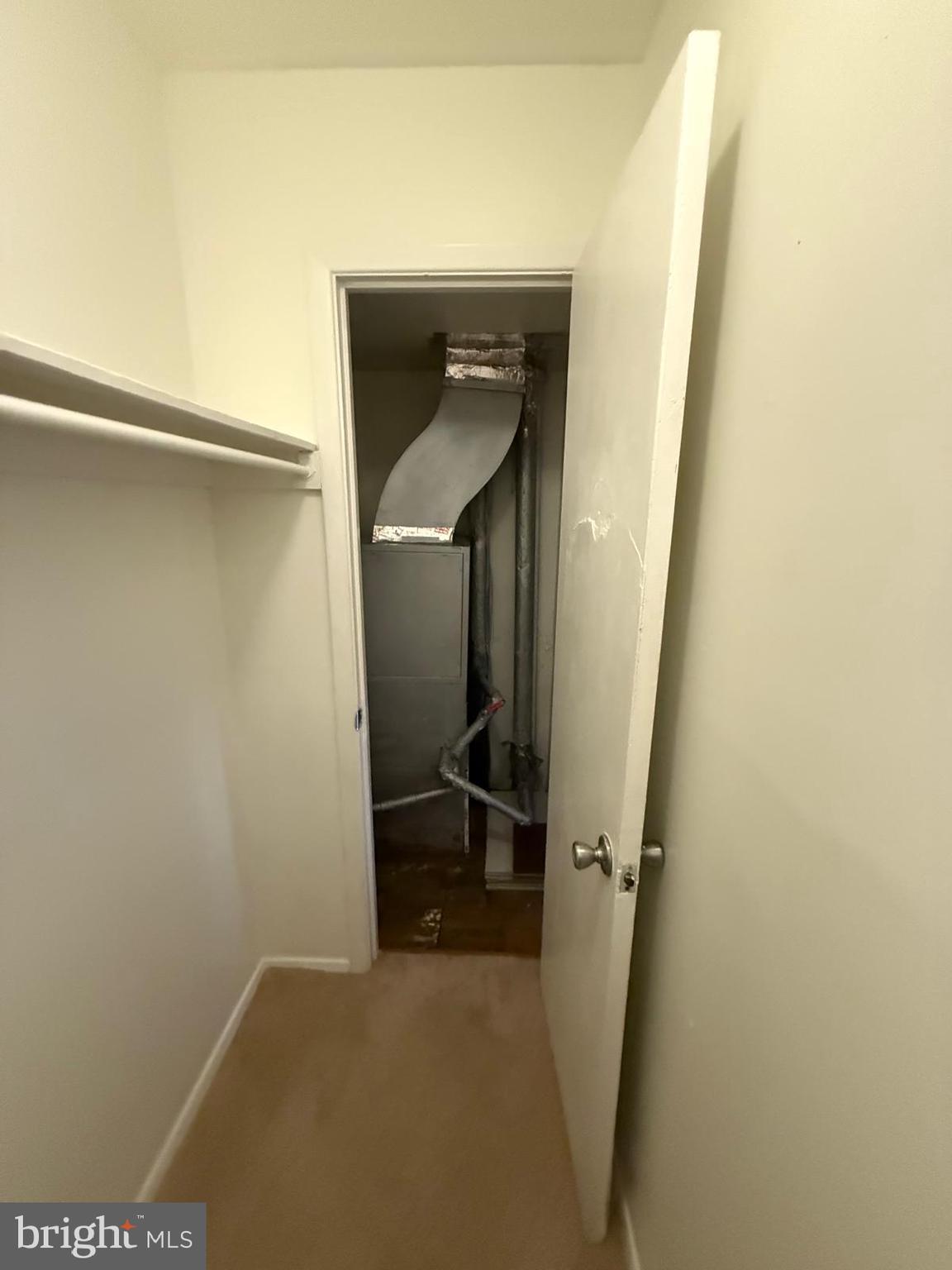 1604 Renate Drive, Unit 104 Woodbridge, VA 22192 - Photo 24 of 29 a view of hallway with stairs and a closet