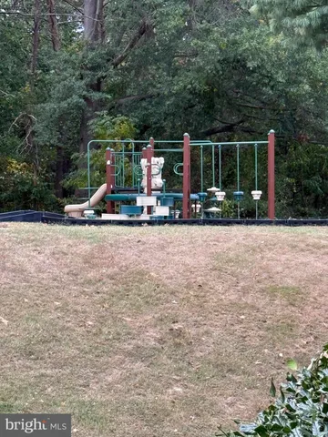 a view of swimming pool with sitting area and furniture