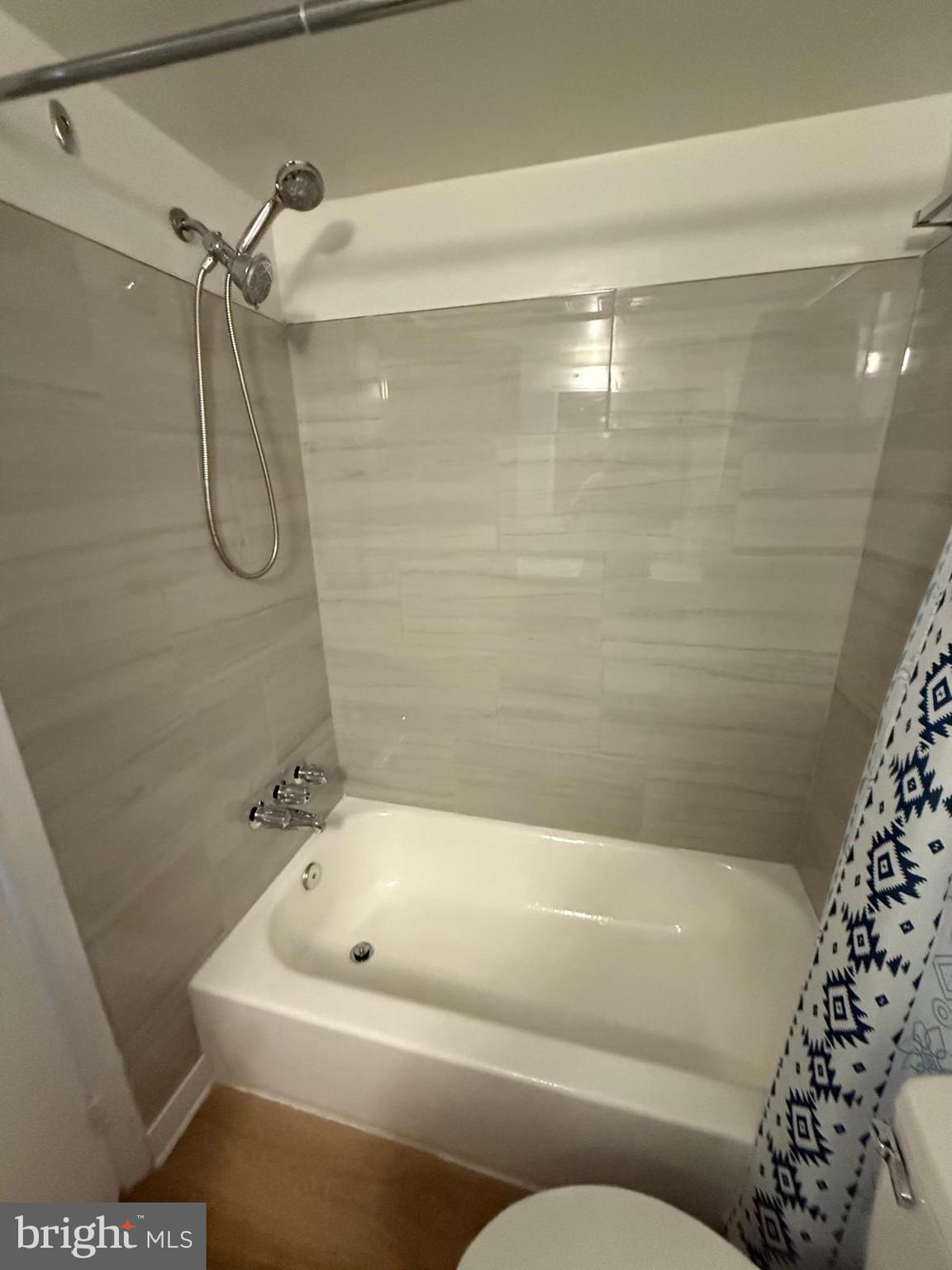 1604 Renate Drive, Unit 104 Woodbridge, VA 22192 - Photo 4 of 29 a bathroom with a bathtub and shower