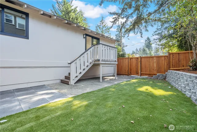 a view of backyard with tub and entertaining space