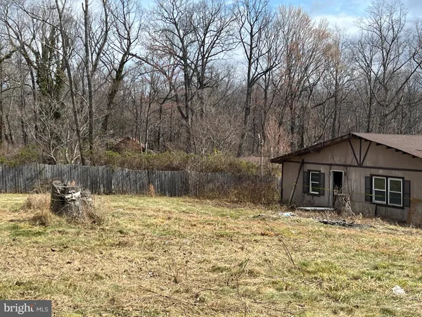 a house with trees in the background