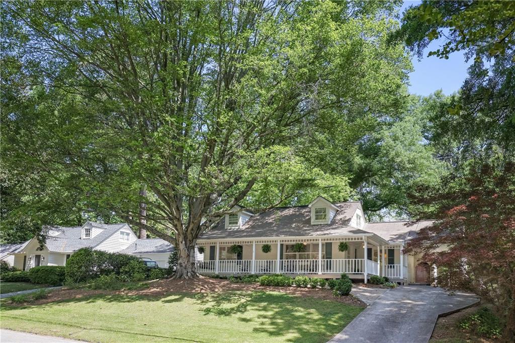 2515 Ridgewood Road Northwest Atlanta, GA 30318 - Photo 1 of 1 a front view of a house with garden