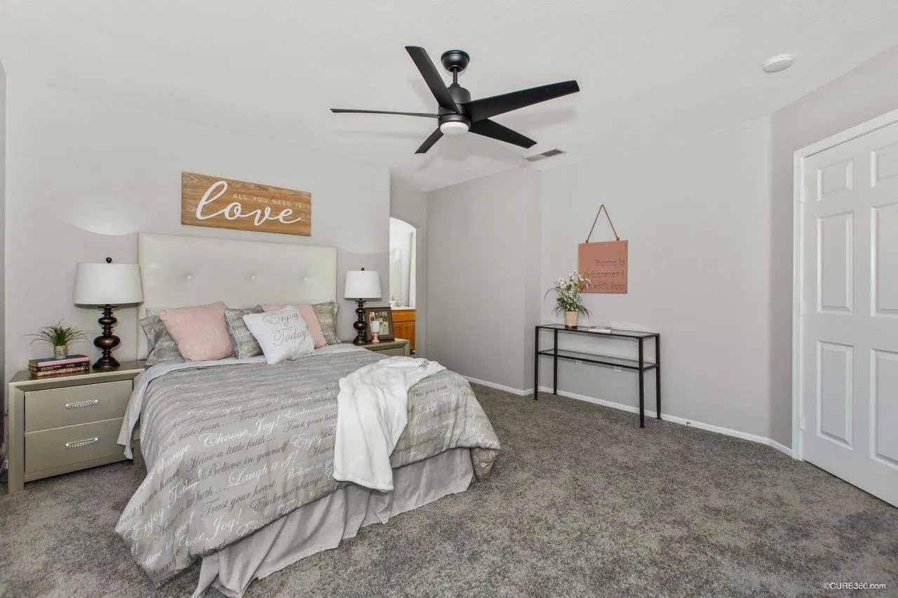 1867 McDougal Terrace El Cajon, CA 92021 - Photo 20 of 28 a bedroom with a bed dresser and a window