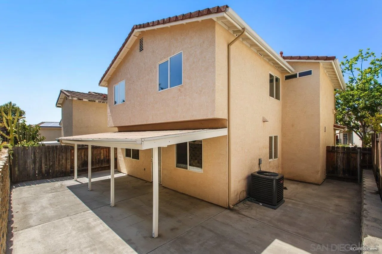 1867 McDougal Terrace El Cajon, CA 92021 - Photo 26 of 28 a front view of a house with a garage