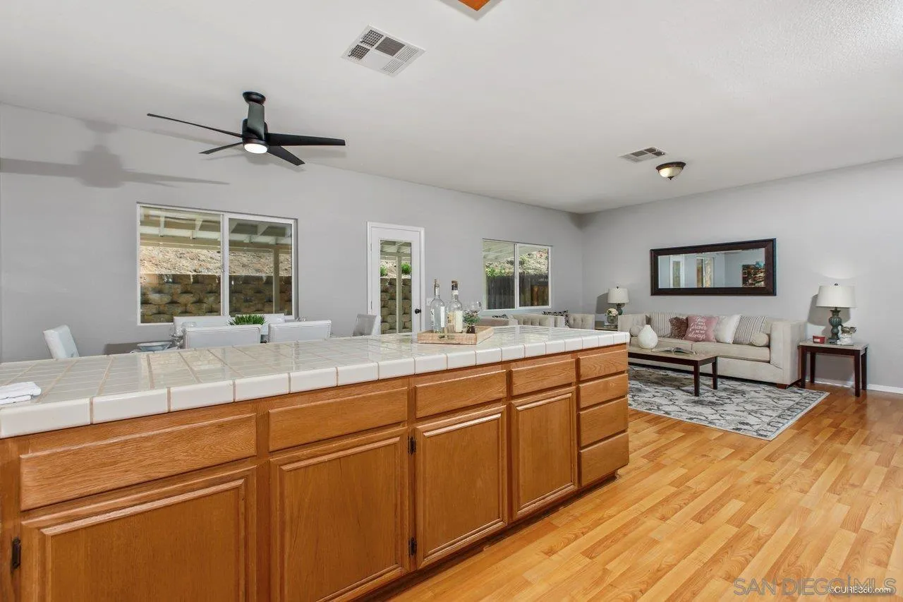 1867 McDougal Terrace El Cajon, CA 92021 - Photo 10 of 28 a spacious bathroom with stainless steel appliances double vanity sink and a mirror