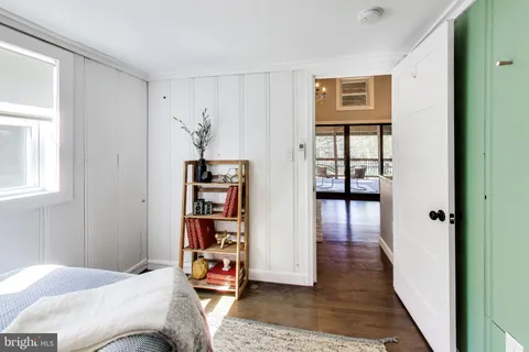 a bedroom with furniture and window