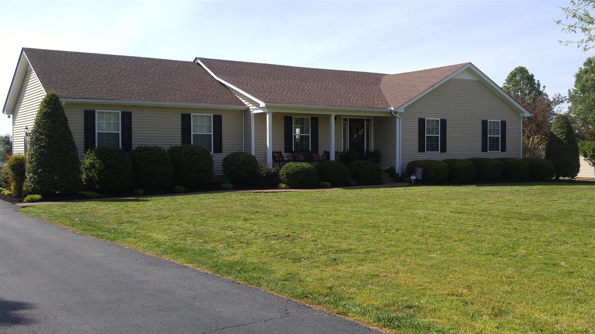 282 Collins Road Portland, TN 37148 - Photo 2 of 28 a front view of a house with a garden