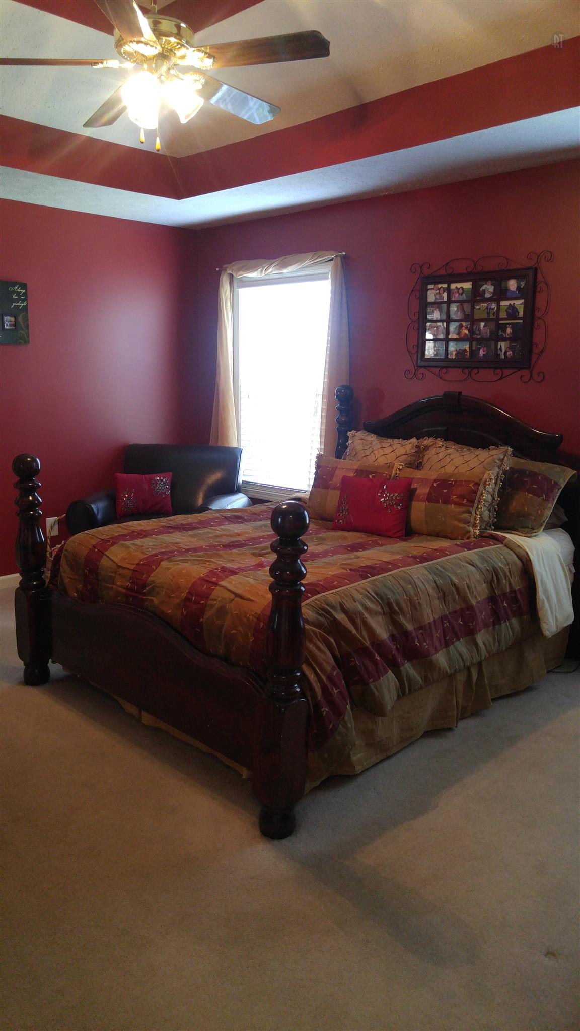 282 Collins Road Portland, TN 37148 - Photo 15 of 28 a bedroom with a bed and a chandelier