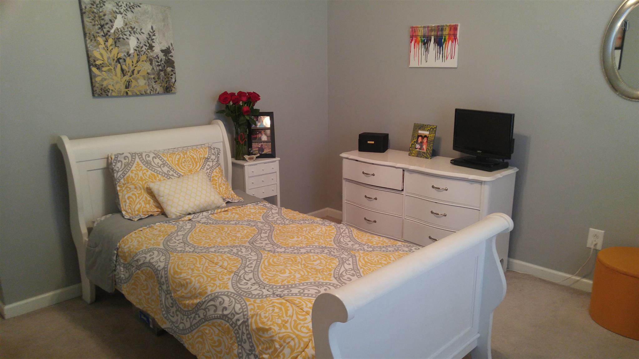 282 Collins Road Portland, TN 37148 - Photo 19 of 28 a bedroom with a bed and a flat screen tv