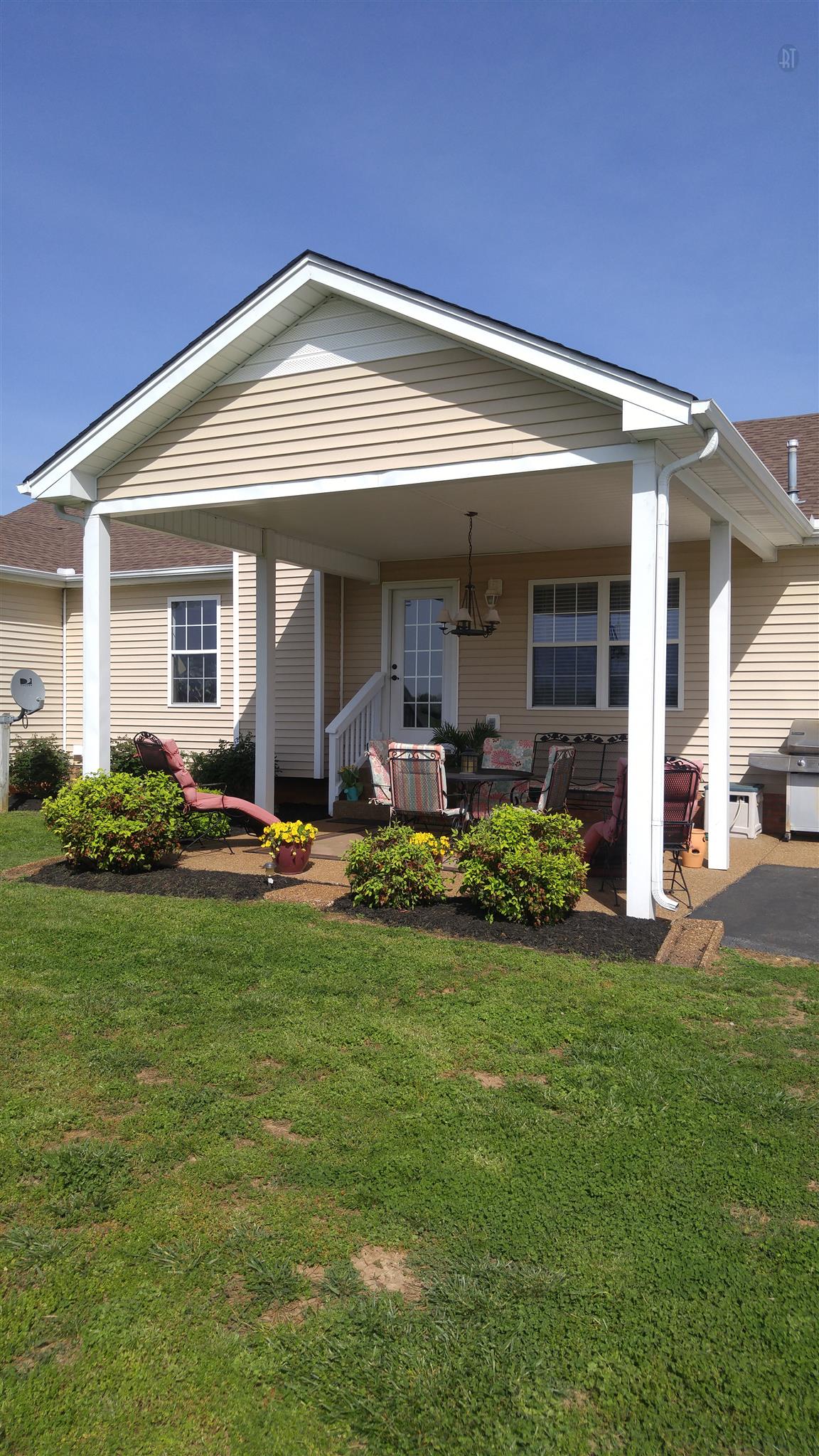 282 Collins Road Portland, TN 37148 - Photo 26 of 28 a front view of a house with a garden and plants