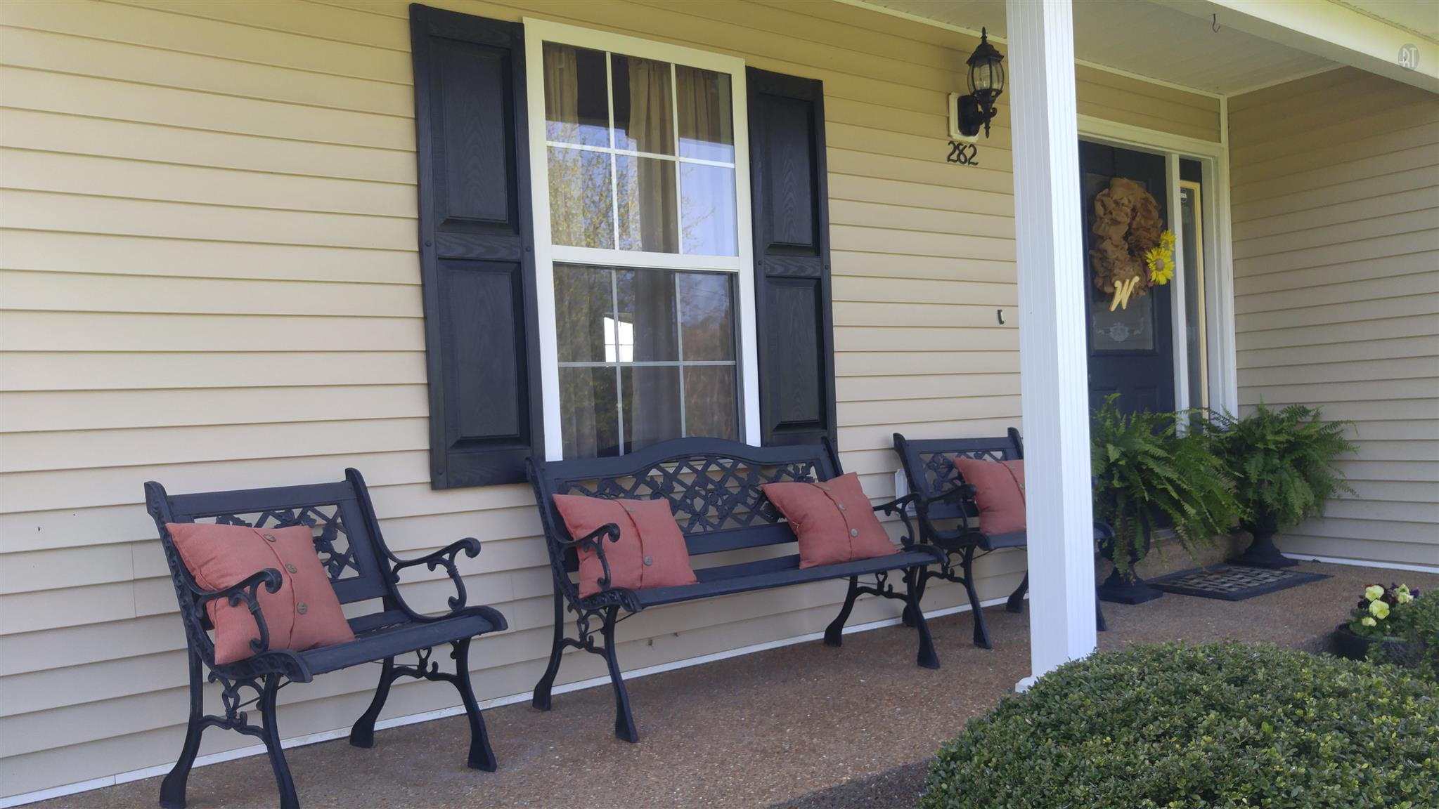 282 Collins Road Portland, TN 37148 - Photo 28 of 28 a view of a house with chairs and table in a patio