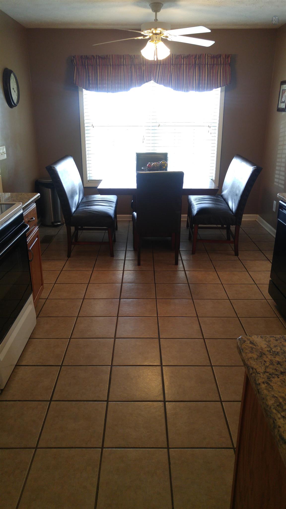 282 Collins Road Portland, TN 37148 - Photo 10 of 28 a living room with couches a dining table and a piano